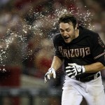Arizona Diamondbacks center fielder A.J. Pollock gets water thrown on him after hitting a two-run walk off home run in the ninth inning during a baseball game against the San Diego Padres, Monday, May 26, 2014, in Phoenix. (AP Photo/Rick Scuteri)