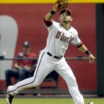 Arizona Diamondbacks' Gerardo Parra catches a fly-out by Washington Nationals' Tyler Moore during the sixth inning of a baseball game on Friday, Sept. 27, 2013, in Phoenix. (AP Photo/Matt York)