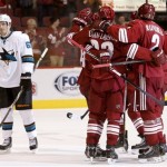 Phoenix Coyotes' Oliver Ekman-Larsson (23), of Sweden, celebrates his goal with teammates, including David Rundblad (2), of Sweden, as San Jose Sharks' Alex Stalock (32) and Justin Braun (61) skate away during the third period in an NHL preseason hockey game on Friday, Sept. 27, 2013, in Glendale, Ariz. The Coyotes defeated the Sharks 2-1. (AP Photo/Ross D. Franklin)