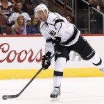 Los Angeles Kings' Jeff Carter gets ready to shoot prior to scoring a goal against the Arizona Coyotes during the first period of an NHL hockey game Saturday, Oct. 11, 2014, in Glendale, Ariz. (AP Photo/Ross D. Franklin)