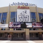               FILE - This April 12, 2010, file photo, shows an entrance to the Jobing.com Arena home of the Phoenix Coyotes NHL hockey playoff team in Glendale, Ariz. The city of Glendale has called for a special meeting on Wednesday, June 10, 2015, to determine whether to end an arena lease agreement with the Coyotes, further clouding the team's future in the desert. (AP Photo/Ross D. Franklin, File)
            