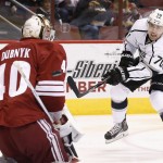 Los Angeles Kings' Tanner Pearson (70) shoots the puck past Arizona Coyotes' Devan Dubnyk (40) for a goal during the first period of an NHL hockey game Saturday, Oct. 11, 2014, in Glendale, Ariz. (AP Photo/Ross D. Franklin)