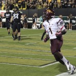 Arizona State running back Marion Grice, foreground, scores a touchdown past Colorado defenders in the first quarter of an NCAA college football game in Boulder, Colo., Thursday, Oct. 11, 2012. (AP Photo/David Zalubowski)