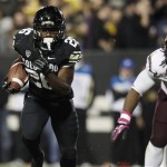 Colorado tailback Tony Jones, left, runs around the end to score a touchdown against Arizona State in the second quarter of an NCAA college football game in Boulder, Colo., Thursday, Oct. 11, 2012. (AP Photo/David Zalubowski)