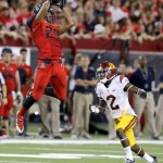 Arizona running back Austin Hill (29) makes the catch in front of Southern California cornerback Adoree' Jackson (2) during the first half of an NCAA college football game, Saturday, Oct. 11, 2014, in Tucson, Ariz. (AP Photo/Rick Scuteri)