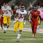 Southern California running back Javorius Allen (37) runs for his second touchdown during the first half of an NCAA college football game against Arizona, Saturday, Oct. 11, 2014, in Tucson, Ariz. (AP Photo/Rick Scuteri)