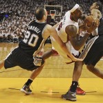 San Antonio Spurs forward Kawhi Leonard (2) and San Antonio Spurs shooting guard Manu Ginobili (20) defend against Miami Heat forward LeBron James (6) during the second half of Game 1 in the NBA Finals basketball game, Thursday, June 6, 2013 in Miami. (AP Photo/Steve Mitchell, Pool)