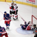 Ottawa Senators' Erik Condra, above left, and Nick Foligno, above right, celebrate after Condra scored as New York Rangers goalie Henrik Lundqvist watches during the third period of Game 1 of a first-round NHL hockey playoff series, Thursday, April 12, 2012, in New York. The Rangers won 4-2. (AP Photo/Frank Franklin II)