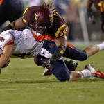 Illinois quarterback Reilly O'Toole (4) is tackled by Arizona State defensive tackle Will Sutton (90) during the first half of an NCAA college football game, Saturday, Sept. 8, 2012, in Tempe, Ariz. (AP Photo/Matt York)
