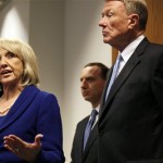 Arizona Gov. Jan Brewer, left, speaks at a news conference at a U.S. Circuit Court of Appeals building with attorney John Bouma, right, and Governor's office counsel Joe Kanefield, rear, in San Francisco, Monday, Nov. 1, 2010. A federal appeals court is hearing arguments over Arizona's request to enforce its controversial new immigration law. (AP Photo/Jeff Chiu)