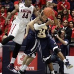 Arizona's Solomon Hill (44) blocks a shot from Northern Arizona's Durrell Norman (34) during the first half of an NCAA college basketball game at McKale Center in Tucson, Ariz., Saturday, Dec. 3, 2011. (AP Photo/Wily Low)
