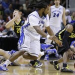 Oregon's Johnathan Loyd, right, drives the ball past Saint Louis guard Jordair Jett (5) during the second half of a third-round game in the NCAA college basketball tournament Saturday, March 23, 2013, in San Jose, Calif. Oregon won the game, 74-57. (AP Photo/Ben Margot)
