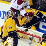 Phoenix Coyotes left wing Taylor Pyatt (14) hits Nashville Predators center Nick Spaling (13) in the second period of Game 4 in an NHL hockey Stanley Cup Western Conference semifinal playoff series, Friday, May 4, 2012, in Nashville, Tenn. (AP Photo/Mike Strasinger)