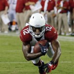 Arizona Cardinals wide receiver Andre Roberts (12) dives into the end zone on a three-yard pass play for a touchdown against the Tennessee Titans in the second quarter of an NFL football preseason game on Thursday, Aug. 23, 2012, in Nashville, Tenn. (AP Photo/Joe Howell)