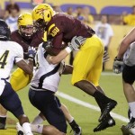  Arizona State running back Marion Grice, right, jumps in the endzone for a first half touch down against Northern Arizona during a football game on Thursday, Aug. 30 2012, in Tempe, Ariz. (AP Photo/Rick Scuteri)