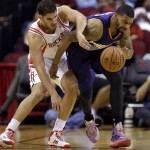 Phoenix Suns' Marcus Morris, right, steals the ball from Houston Rockets' Omri Casspi, left, during the second quarter of an NBA basketball game Wednesday, Dec. 4, 2013, in Houston. (AP Photo/David J. Phillip)