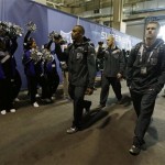 Seattle Seahawks players shoot video as they arrive for media day for the NFL Super Bowl XLVIII football game Tuesday, Jan. 28, 2014, in Newark, N.J. (AP Photo/Jeff Roberson)
