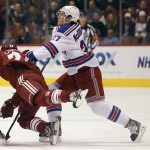 New York Rangers defenseman Ryan McDonagh, right, checks Phoenix Coyotes center Kyle Chipchura, left, during the first period of an NHL hockey game Saturday, Dec. 17, 2011, in Glendale, Ariz. (AP Photo/Paul Connors)