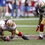 San Francisco 49ers' Ray McDonald (91) recovers a fumble the Arizona Cardinals' John Skelton as teammate Dashon Goldson (38) looks on during the second quarter in an NFL football game, Sunday, Dec. 11, 2011, in Glendale, Ariz.(AP Photo/Paul Connors)