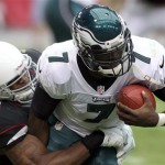 Philadelphia Eagles quarterback Michael Vick, right, is sacked by Arizona Cardinals linebacker Daryl Washington, left, in the second quarter of an NFL football game on Sunday, Sept. 23, 2012, in Glendale, Ariz. (AP Photo/Paul Connors)