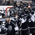 Los Angeles Kings goalie Jonathan Quick, second from upper left, is congratulated by right wing Justin Williams, upper left, after they defeated the Chicago Blackhawks 3-1 in Game 3 of the NHL hockey Stanley Cup Western Conference finals, Tuesday, June 4, 2013, in Los Angeles. (AP Photo/Mark J. Terrill)