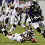 Baltimore Ravens wide receiver Marlon Brown (14) runs past Tampa Bay Buccaneers defensive back Branden Smith (39) after a fourth-quarter reception during an NFL preseason football game Thursday, Aug. 8, 2013, in Tampa, Fla. The Ravens won 44-16. (AP Photo/Chris O'Meara)