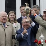 Orb trainer Claude McGaughey, center, is flanked by owners Ogden Phipps, left, and Stuart Janney after winning the 139th Kentucky Derby at Churchill Downs Saturday, May 4, 2013, in Louisville, Ky.(AP Photo/Garry Jones)
