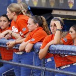 Florida players watch from the dugout in the third inning of a Women's College World Series championship series game against Arizona State in Oklahoma City, Monday, June 6, 2011. (AP Photo/Sue Ogrocki)