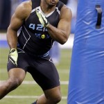 Missouri defensive lineman Michael Sam runs a drill at the NFL football scouting combine in Indianapolis, Monday, Feb. 24, 2014. (AP Photo/Nam Y. Huh)