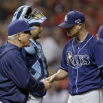 Tampa Bay Rays manager Joe Maddon, left, takes the ball from starting pitcher Alex Cobb in the seventh inning of the AL wild-card baseball game against the Cleveland Indians on Wednesday, Oct. 2, 2013, in Cleveland. (AP Photo/Tony Dejak)