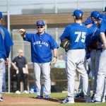 Toronto Blue Jays manager John Gibbons, second from left, talks to his players during spring training baseball in Dunedin, Fla., on Thursday, Feb. 21, 2013. (AP Photo/The Canadian Press, Nathan Denette)