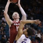 Washington State's Brock Motum (12) shoots against Washington's Abdul Gaddy in the first half during a Pac-12 tournament NCAA college basketball game, Wednesday, March 13, 2013, in Las Vegas. (AP Photo/Julie Jacobson)