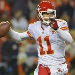 Kansas City Chiefs quarterback Alex Smith (11) rolls out of the pocket to throw against the Denver Broncos in the first quarter of an NFL football game, Sunday, Nov. 17, 2013, in Denver. (AP Photo/Jack Dempsey)