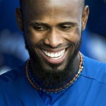 Toronto Blue Jays shortstop Jose Reyes laughs with teammates in the dugout while playing against the Houston Astros during the fifth inning of a spring training exhibition baseball game in Dunedin, Fla., on Wednesday, Feb. 27, 2013. (AP Photo/The Canadian Press, Nathan Denette)