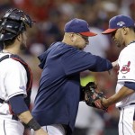 Cleveland Indians manager Terry Francona, center, takes the ball from starting pitcher Danny Salazar in the fifth inning of the AL wild-card baseball game against the Tampa Bay Rays on Wednesday, Oct. 2, 2013, in Cleveland. (AP Photo/Tony Dejak)