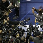 Seattle Seahawks' Richard Sherman takes some pictures during media day for the NFL Super Bowl XLVIII football game Tuesday, Jan. 28, 2014, in Newark, N.J. (AP Photo/Charlie Riedel)