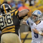Detroit Lions quarterback Matthew Stafford (9) passes as Pittsburgh Steelers defensive end Ziggy Hood (96) defends in the first half an NFL football game on Sunday, Nov. 17, 2013, in Pittsburgh. the steelers won 37-27. (AP Photo/Don Wright)