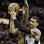 San Antonio Spurs' Danny Green (4) shoots over Miami Heat's Udonis Haslem (40) during the first half at Game 5 of the NBA Finals basketball series, Sunday, June 16, 2013, in San Antonio. (AP Photo/Eric Gay)