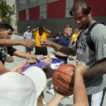 DeMarcus Cousins of the Sacramento Kings signs autographs for fans after a USA Basketball mini camp practice, Monday, July 22, 2013, in Las Vegas. Twenty-eight of the best young players in the country are in Las Vegas for four days of workouts that essentially mark the kickoff of 2016 Olympic preparations. (AP Photo/Julie Jacobson)