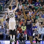  Utah Jazz's Gordon Hayward (20) shoots as Phoenix Suns' Channing Frye (8) defends in the second quarter of an NBA basketball game on Wednesday, Feb. 26, 2014, in Salt Lake City. (AP Photo/Rick Bowmer)