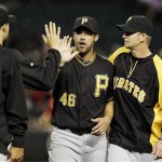 Pittsburgh Pirates' Garrett Jones (46), who had threehits on the night, celebrates a win over the Arizona Diamondbacks with teammates, including A.J. Burnett, right, after the ninth inning in an MLB baseball game Tuesday, April 17, 2012, in Phoenix. The Pirates defeated the Diamondbacks 5-4.(AP Photo/Ross D. Franklin)