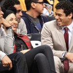 Seattle Seahawks quarterback Russell Wilson, right, shares a laugh with rapper Jay Z, left, and singer Beyonce, during the Brooklyn Nets NBA basketball game against the Philadelphia 76ers at the Barclays Center, Monday, Feb. 3, 2014 in New York. (AP Photo/Kathy Willens)