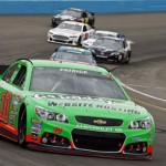 Danica Patrick (10) leads a group of cars out of Turn 4 during the NASCAR Sprint Cup Series auto race, Sunday, March 3, 2013, in Avondale, Ariz. (AP Photo/Ross D. Franklin)