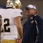  Notre Dame head coach Brian Kelly, right, confers with backup quarterback Andrew Hendrix after Hendrix was sacked against Air Force late in the fourth quarter of Notre Dame's 45-20 victory in an NCAA college football game in Air Force Academy, Colo., Saturday, Oct. 26, 2013. (AP Photo/David Zalubowski)