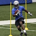 Detroit Lions running back Theo Riddick runs through drills during NFL football rookie minicamp at their team's training facility in Allen Park, Mich., Saturday, May 11, 2013. (AP Photo/Carlos Osorio)
