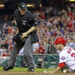 Washington Nationals' Bryce Harper (34) slides across home plate as Arizona Diamondbacks catcher Miguel Montero loses the ball during the fourth inning of a baseball game, Wednesday, May 2, 2012, in Washington. At center is home plate umpire Bill Welke. (AP Photo/Haraz N. Ghanbari)