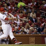 St. Louis Cardinals' Matt Holliday hits a home run during the fourth inning of Game 5 of baseball's World Series against the Boston Red Sox Monday, Oct. 28, 2013, in St. Louis. (AP Photo/Jeff Roberson)