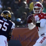 South quarterback Derek Carr (4), of Fresno St., rolls out to pass away from the pressure of North line backer Michael Sam (55), of Missouri, during the first half of the Senior Bowl NCAA college football game on Saturday, Jan. 25, 2014, in Mobile, Ala. (AP Photo/Butch Dill)