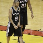 The San Antonio Spurs' Tony Parker (9) and Tim Duncan (21) walk on the court during the second half in Game 7 of the NBA basketball championship against the Miami Heat, Thursday, June 20, 2013, in Miami. The Miami Heat won 95-88. (AP Photo/Wilfredo Lee)
