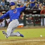 Chicago Cubs' Anthony Rizzo beats the throw to the plate as he scores on a double by teammate Nate Schierholtz during the 11th inning of a baseball game against the Arizona Diamondbacks, Wednesday, July 24, 2013, in Phoenix. (AP Photo/Matt York)